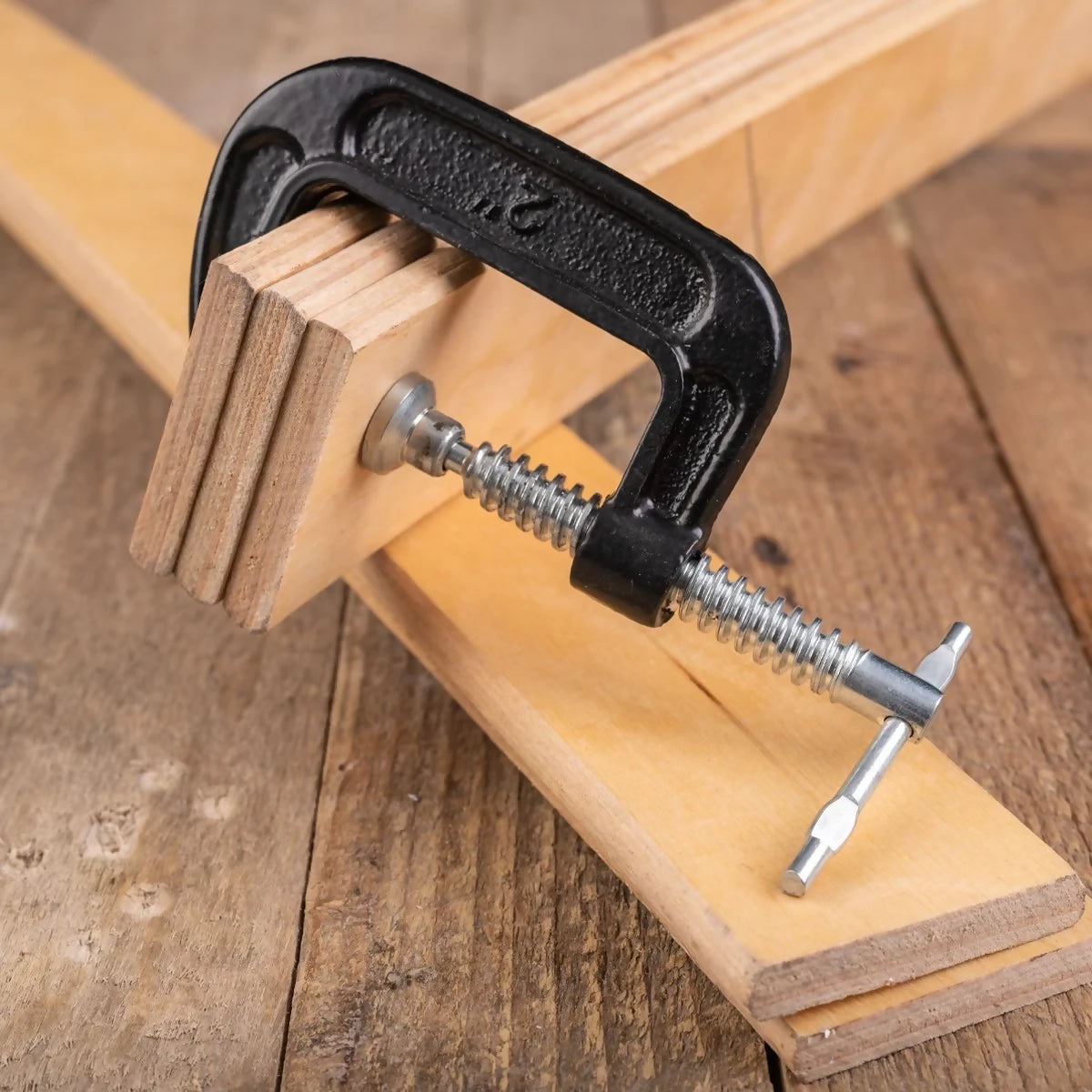 GettyImages-Carpentry-clamp-used-for-gluing-wood-1251594347-by-Piotr-Wytrazek