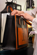 Maxime-womens-leather-tote-bag-black-orange-side-view-spacious-JULKE